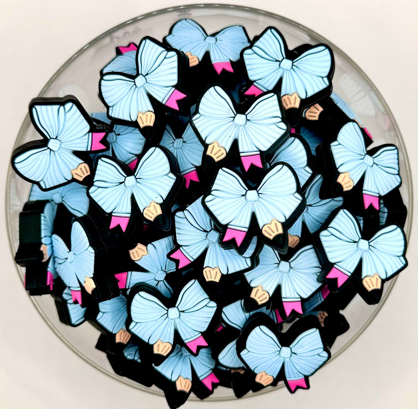 Pastel blue pencil bow silicone focal bead