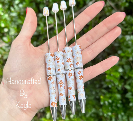 Burnt orange daisy print pen (HBK exclusive)